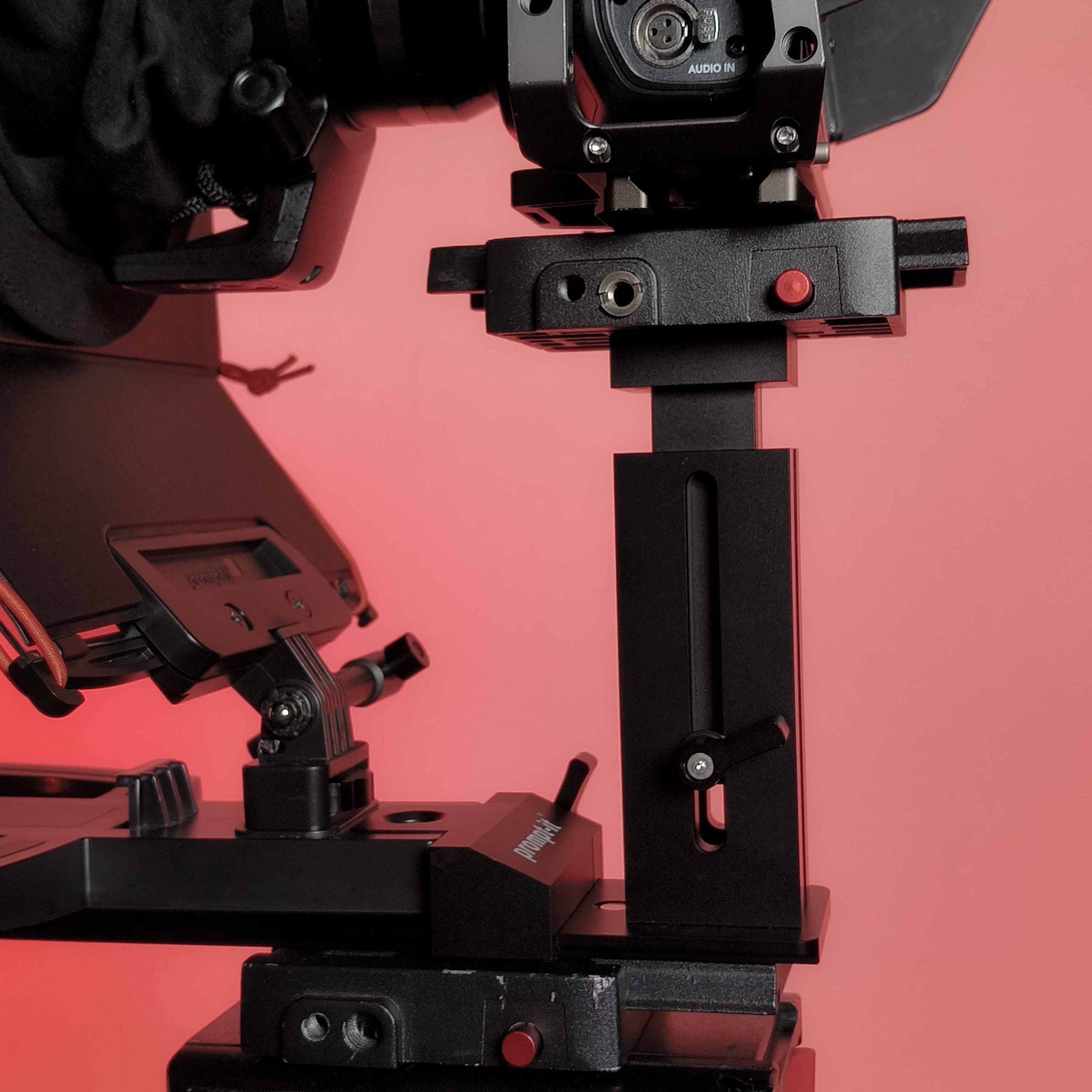Close-up detail of Prompt It FLEX rig standard vertical support showing height adjustment slot and locking mechanism.